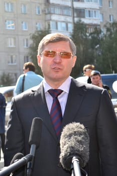 The governor of the Tyumen region Vladimir Yakushev at official opening of a new traffic intersection on Melnikayte St., Tyumen. 22.08.2013