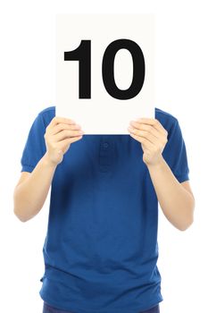 A teenager holding up a signboard with the number ten