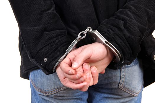 Rear view of the Man in Handcuffs on the White Background Closeup