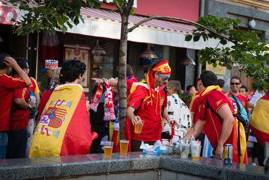 KIEV, UKRAINE - JUL 1: Spanish football fans drink beer before final match EURO 2012 Spain vs. Italy on July 1, 2012 in Kiev, Ukraine