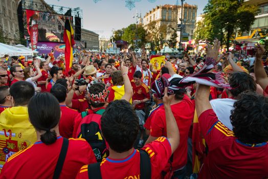 KIEV, UKRAINE - JUL 1: Spanish football fans prepare on the central fun zone for EURO 2012 final match Spain vs. Italy on July 1, 2012 in Kiev, Ukraine