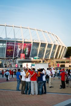 KIEV, UKRAINE - JUL 1: People in front of the  stadium before EURO 2012 final match Spain vs. Italy on July 1, 2012 in Kiev, Ukraine