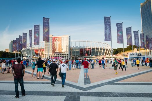 KIEV, UKRAINE - JUL 1: Crowd of people in front of stadium before EURO 2012 final match Spain vs. Italy on July 1, 2012 in Kiev, Ukraine