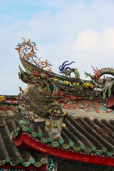 An intricate rooftop element on a building from the Imperial palace complex in Hue, Vietnam