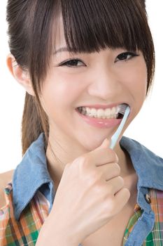 Closeup portrait of woman brushing teeth.