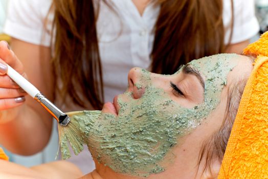 Young woman in beauty salon getting beautiful