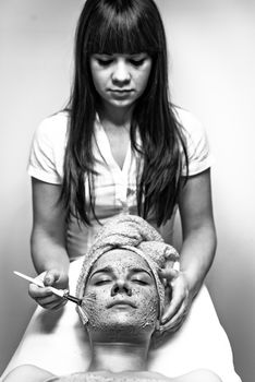 Young woman getting health treatment on bed