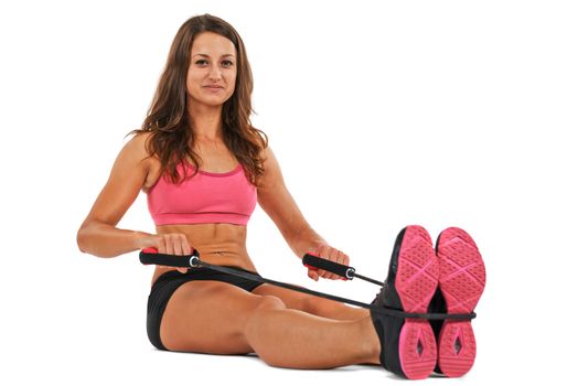 Young woman in the studio streching and working out