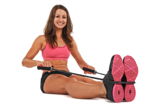 Young woman in the studio streching and working out