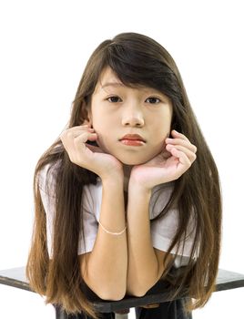 Asian girl supports her chin with her  isolated on white  background