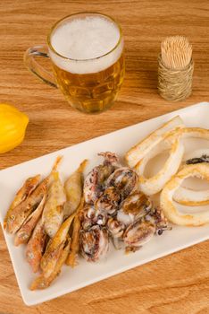 A traditional fish appetizer and a beer to wash it down