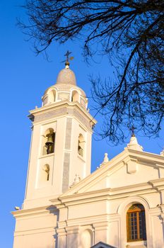 Tower of a white church near Recoleta Cemetery in Buenos Aires, Argentina