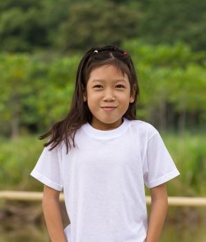 Outdoors portrait of beautiful Asian young girl