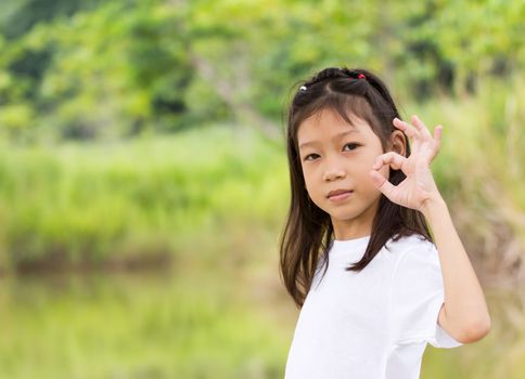 Outdoors portrait of beautiful Asian young girl