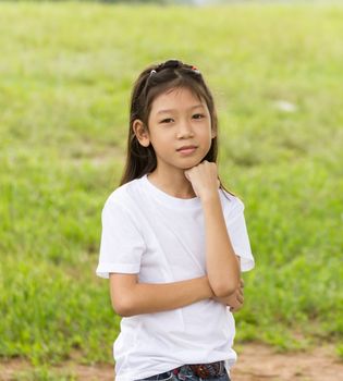 Outdoors portrait of beautiful Asian young girl