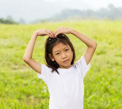 Outdoors portrait of beautiful Asian young girl