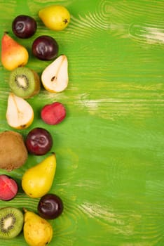 Fresh fruit arranged on a rustic background