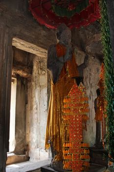 A statue of Buddha in Angkor Wat complex in Siem Reap, Cambodia
