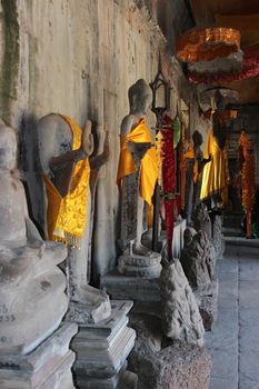 A row of statues of Buddha in Angkor Wat complex in Cambodia