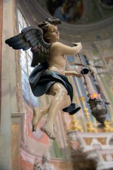 ancient wooden statue of an angel