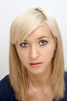 A studio close-up of a lovely young blonde.