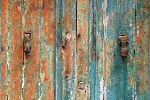 peeling door damaged from weather and the passage of time