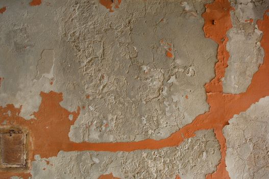 peeling wall damaged by the weather and the passage of time