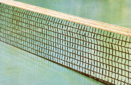 Tennis field and a tennis net.