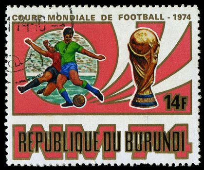 Republic of Burundi, - CIRCA 1974: A stamp printed by Burundi showing football players, circa 1974