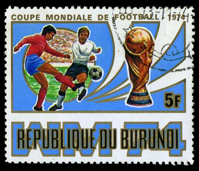 Republic of Burundi, - CIRCA 1974: A stamp printed by Burundi showing football players, circa 1974