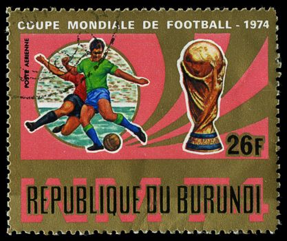 Republic of Burundi, - CIRCA 1974: A stamp printed by Burundi showing football players, circa 1974