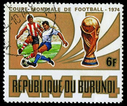 Republic of Burundi, - CIRCA 1974: A stamp printed by Burundi showing football players, circa 1974