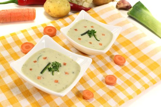 vegetable soup with carrots on a light background