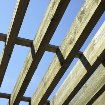 large wooden beams and blue sky