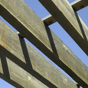 large wooden beams and blue sky