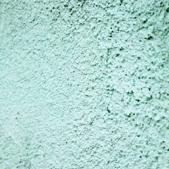 turquoise stucco wall close up