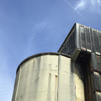 Large concrete silo against the blue sky