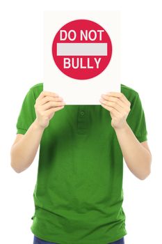 A teenager holding up a Do Not Bully sign