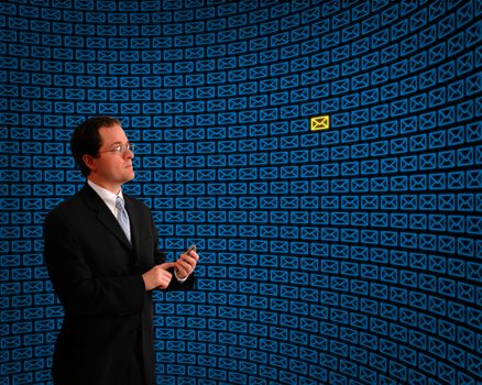 Man monitoring a field of blue email messages