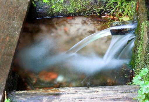 Water flows of the large flow through axially to the draft tube from underground source of water.