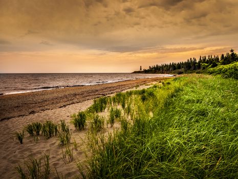 Cape Jourimain Beach and Lighthouse located in New Brunswick Canada hdr with dramatic sky
