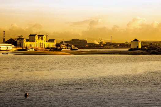 Tagus river with windmill in the background.