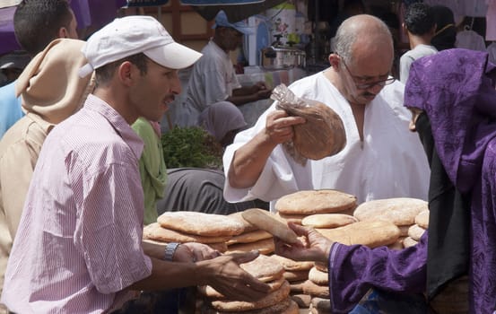 MARRAKECH, MOROCCO SEPT 15TH: A busy bread stall on the market on September 15th 2010. Moroccan bread is served with a traditional Moroccan meal.