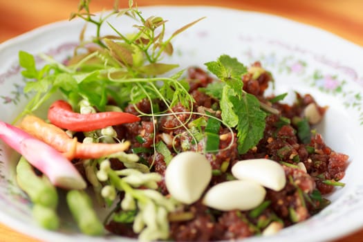 raw minced meat for thai food on a plate