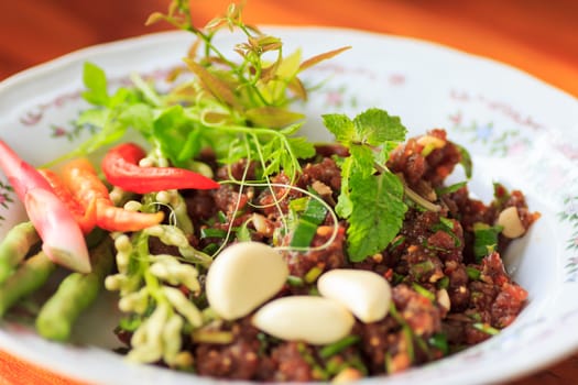 raw minced meat for thai food on a plate