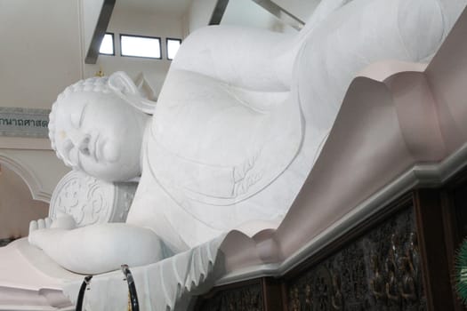 white statue of buddha in Udonthanee of Thailand.