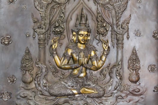 art on metal plate about buddha history at temple in Udonthanee  province, Thailand