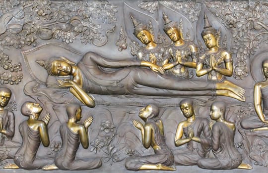 art on metal plate about buddha history at temple in Udonthanee  province, Thailand