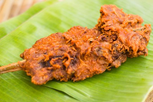 Fried chicken on banana leaf Thailand style