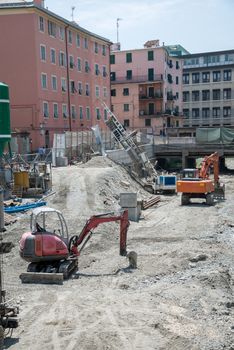 excavators on the bed of a stream